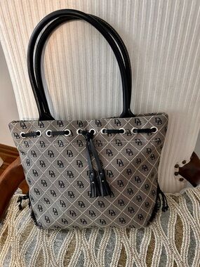 Dooney & Bourke signature bag with leather handles & tassels/rare